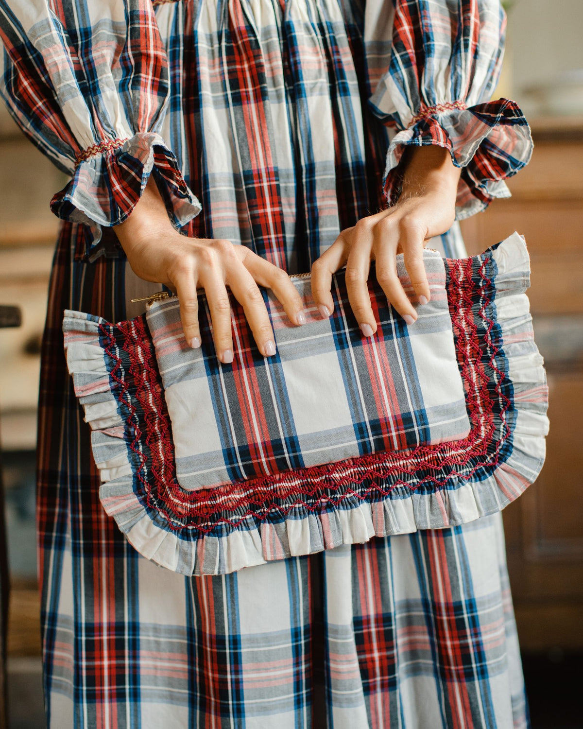 The Dolly Clutch Britannia Check with Winter Berry Hand Smocking