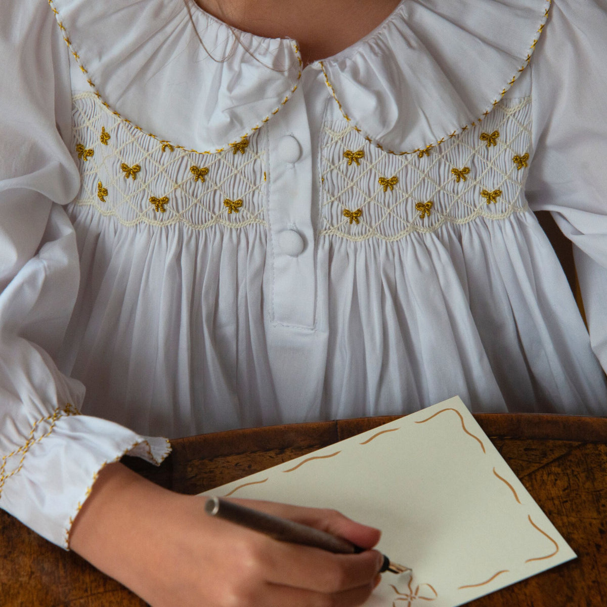 3-4y Memo Press x Smock London Nightingale Girls Dress Moonstone with Gold Bows Hand Smocking
