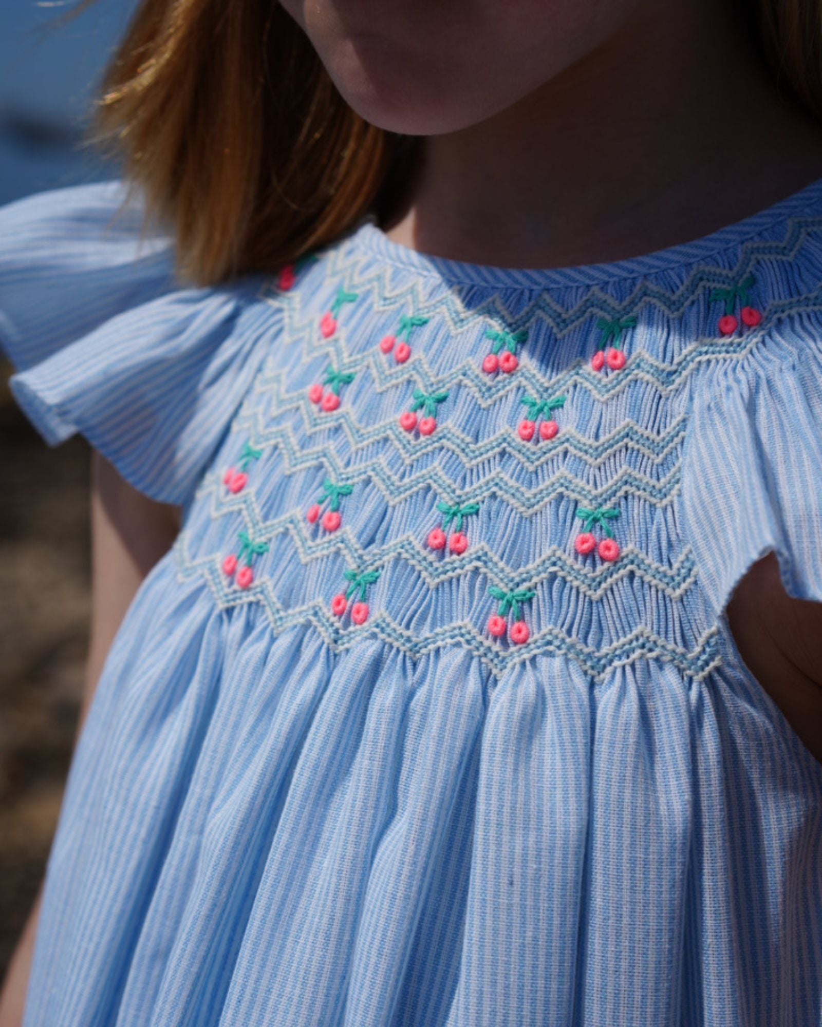 Indira Gandhi Flutter Dress Baby Blue Seersucker with Cherries Hand Smocking