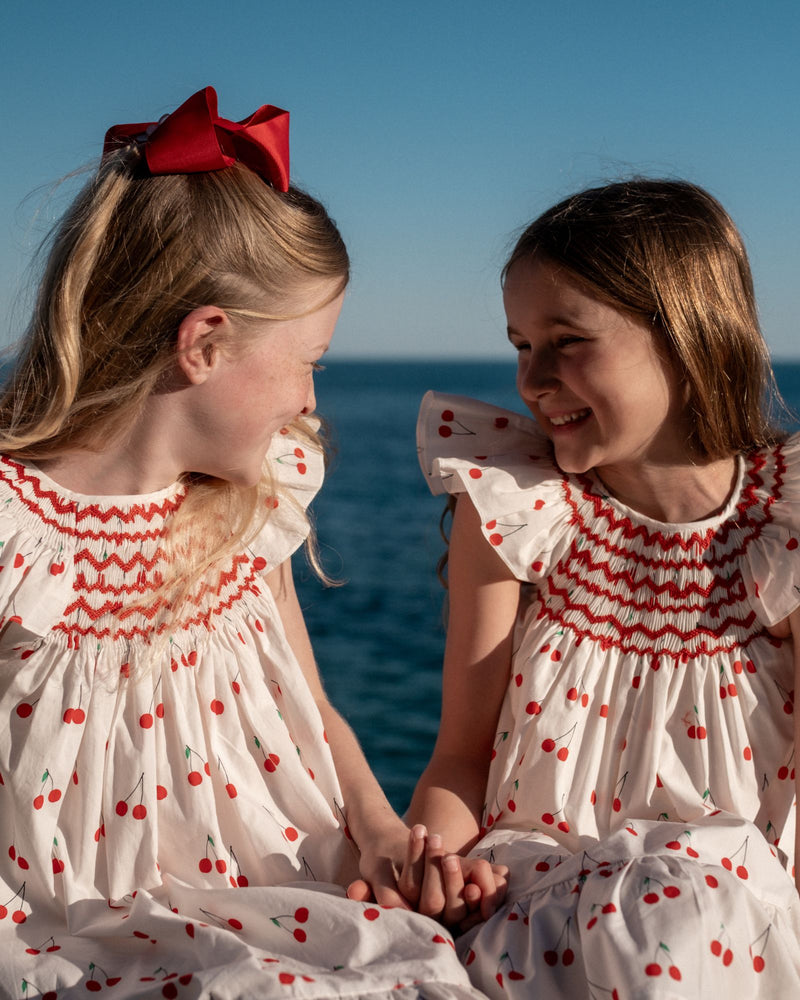 Indira Gandhi Flutter Dress Mon Cherry Cotton with a La Mode Hand Smocking