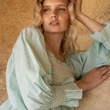 Josefine Butler Dress Kelly Green Seersucker with Cherry Pop Hand Smocking