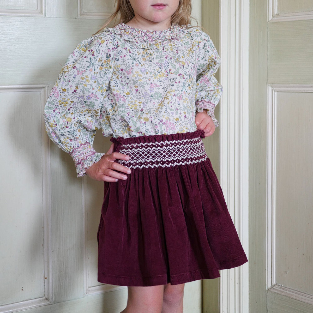 2-3 & 8-10y Annie Sullivan Skirt Mulberry Needlecord with Heather Haze Hand Smocking
