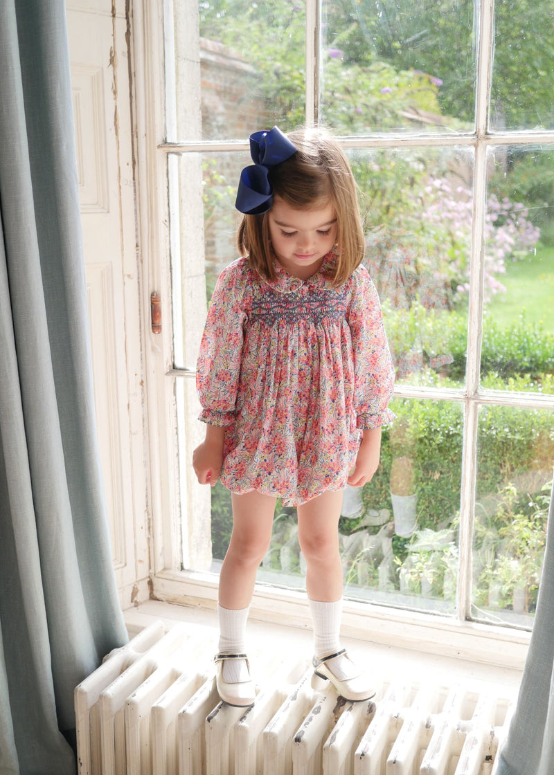 Jane Austen Romper with Swedish Blue Hand Smocking made with Liberty Swirling Petals Fabric