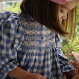 Mirabai Dress Swedish Blue Check with Pink Sky At Night Hand Smocking