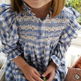 Mirabai Dress Swedish Blue Check with Pink Sky At Night Hand Smocking